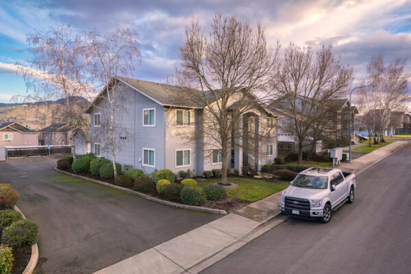 Two-story suburban house with parked pickup truck