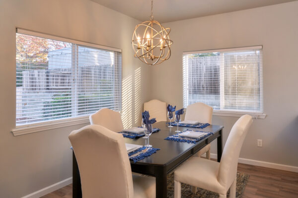 Dining room with black table and upholstered chairs