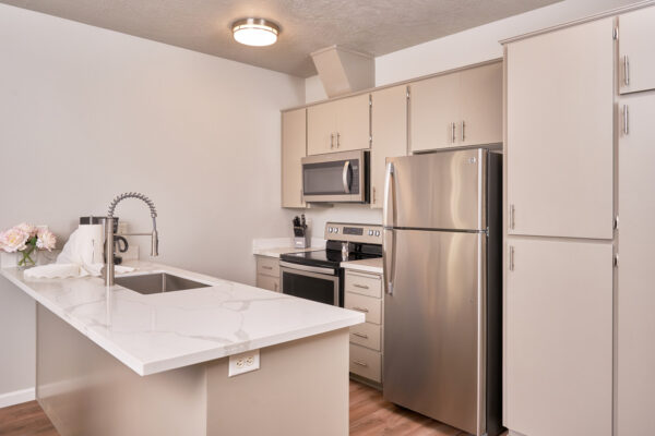Modern kitchen with island and stainless appliances
