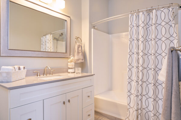 Bright modern bathroom with patterned shower curtain